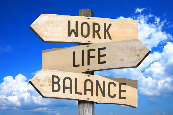 Work life balance sign against a blue sky